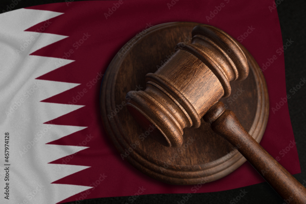 Judge Gavel and flag of Qatar. Law and justice in Qatar. Violation of rights and freedoms
