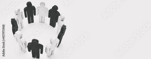 Fotografie Wooden figures of person black and white color stand in circle