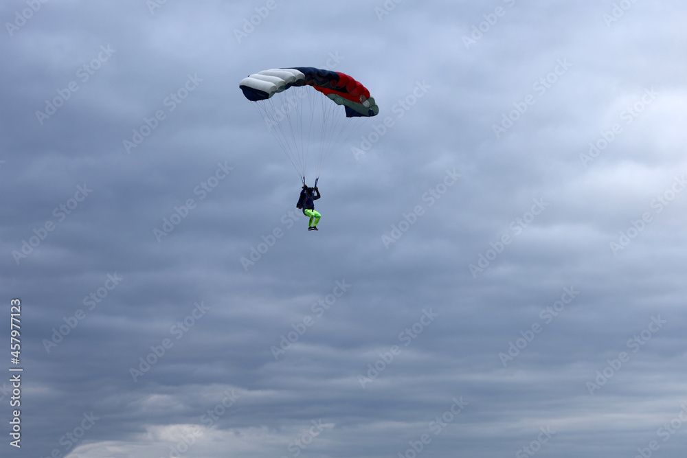 Skydiving. Parachute piloting. A parachute is in the sky.