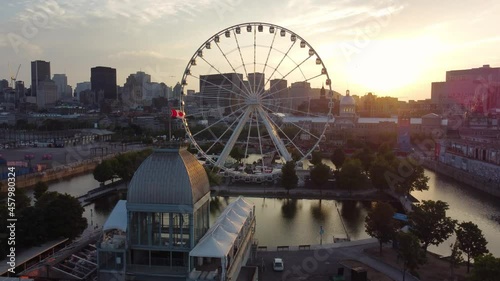 Aerial view of Old Port of Montreal and downtown skyline panorama in summer dusk. Quebec, Canada.