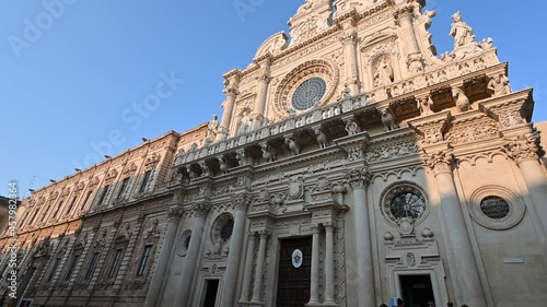 Lecce, Puglia, Italy. August 2021. The church of Santa Croce is the finest example of Lecce baroque. The pan footage displays it in all its beauty with late afternoon light.