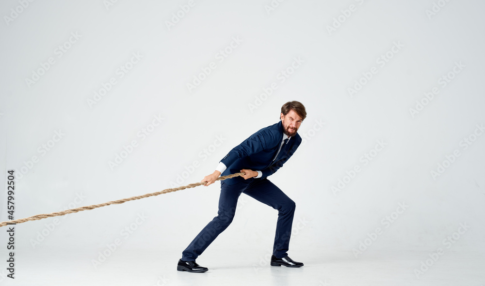 business man in a suit pulls the rope emotions studio business man in a suit pulls the rope emotions studio