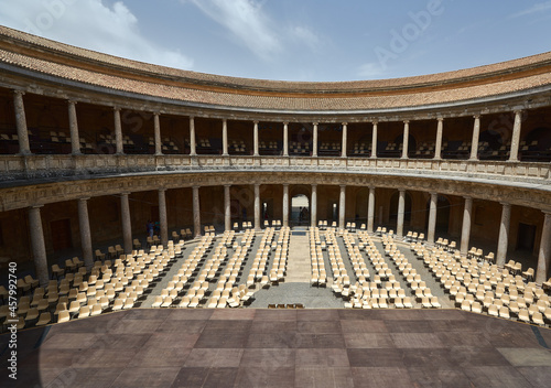 Stage with chairs in the round courtyard of a Muslim palace with columns in the open air