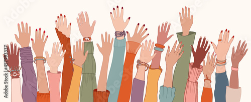 Raised hands and arms of multi-ethnic international multicultural women. Anti-racism racial equality concept. Allyship and sisterhood. Feminism. Women's community cooperation. Women's day