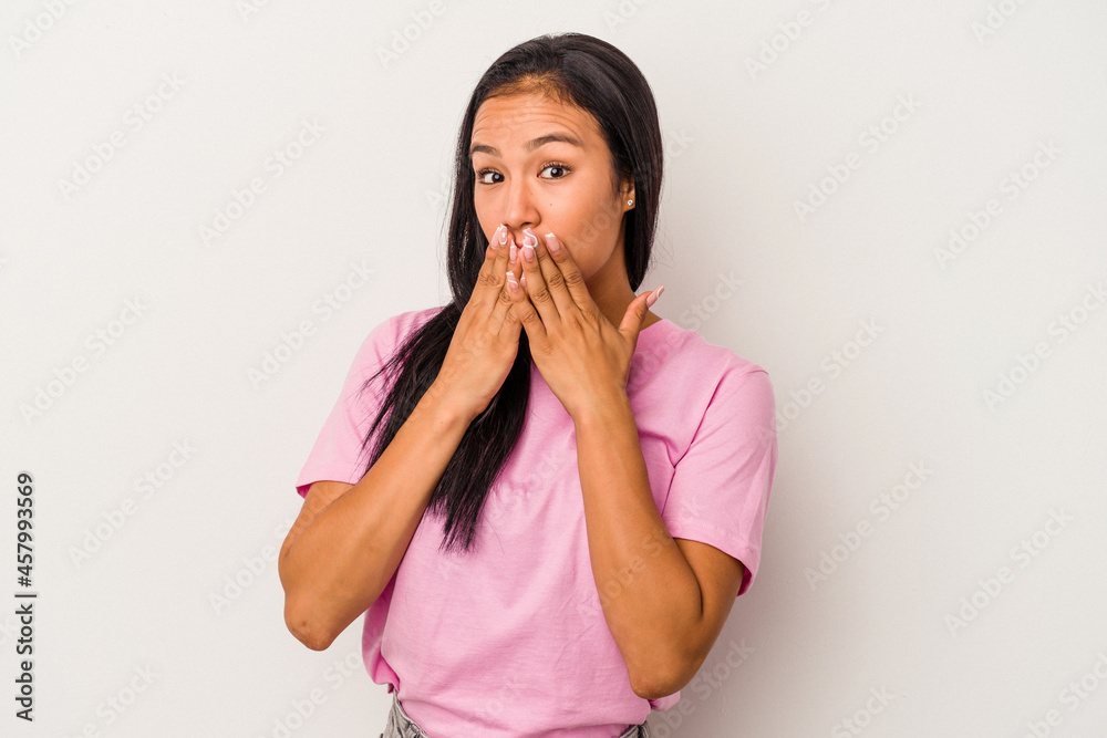 Young latin woman isolated on white background shocked covering mouth with hands. Young latin woman isolated on white background shocked covering mouth with hands.