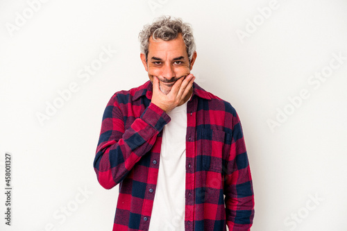 Middle age caucasian man isolated on white background doubting between two options.