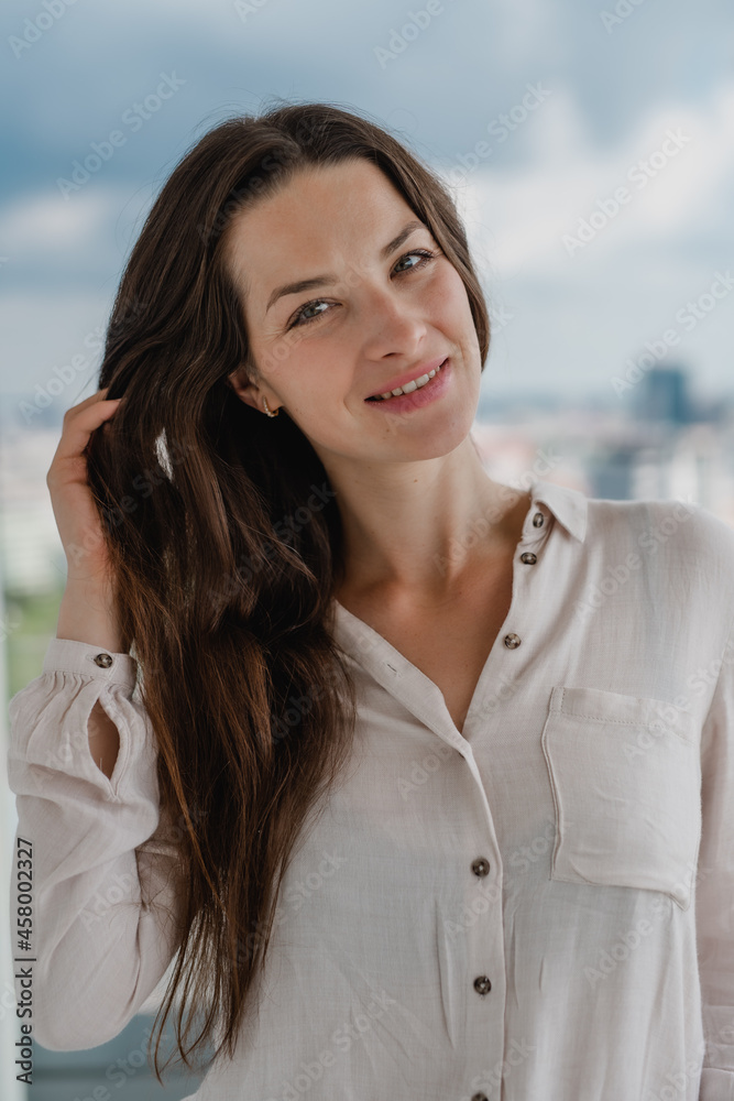 Portrait of young caucasian woman outdoors, looking at camera. Portrait of young caucasian woman outdoors, looking at camera.