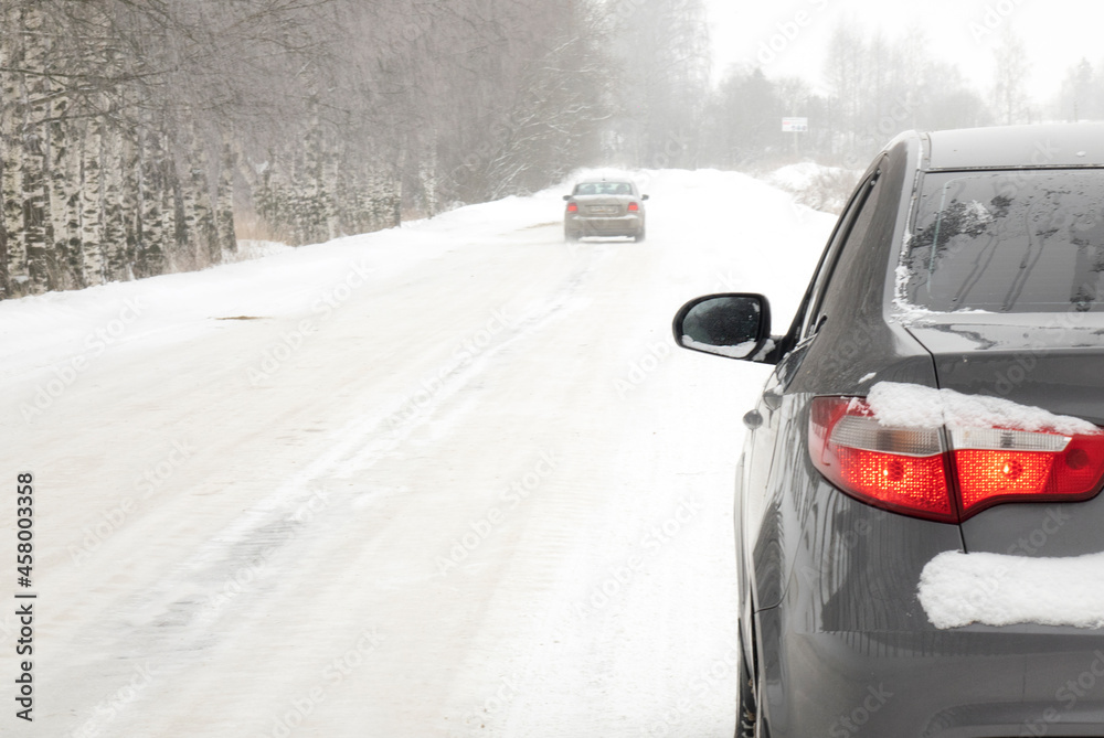 A car on a winter road. The concept of safe driving.