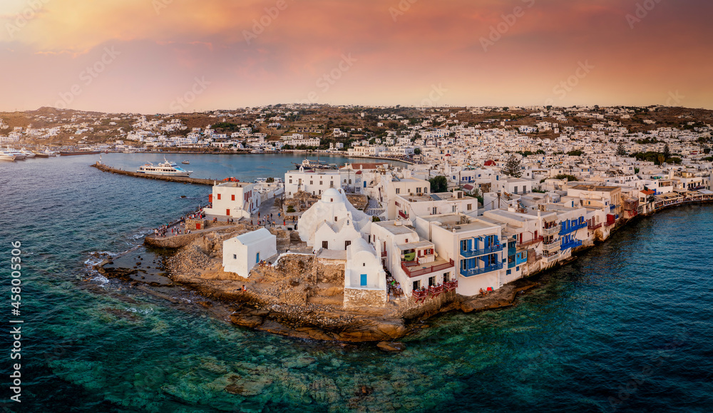 Aerial sunset view of the Paraportiani Church located within the whitewashed houses of Mykonos old town, Aegean Sea, Greece
