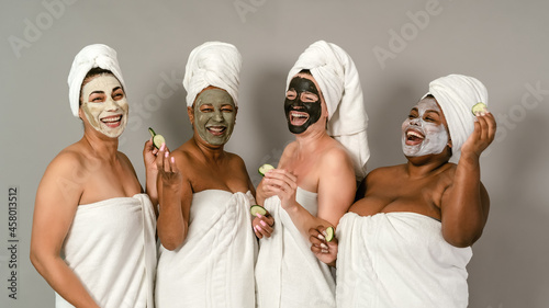 Tableau sur toile Happy multiracial women having skin care spa day - People selfcare concept