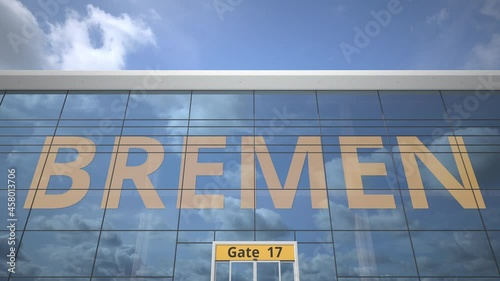 BREMEN city name and landing airplane at airport terminal photo