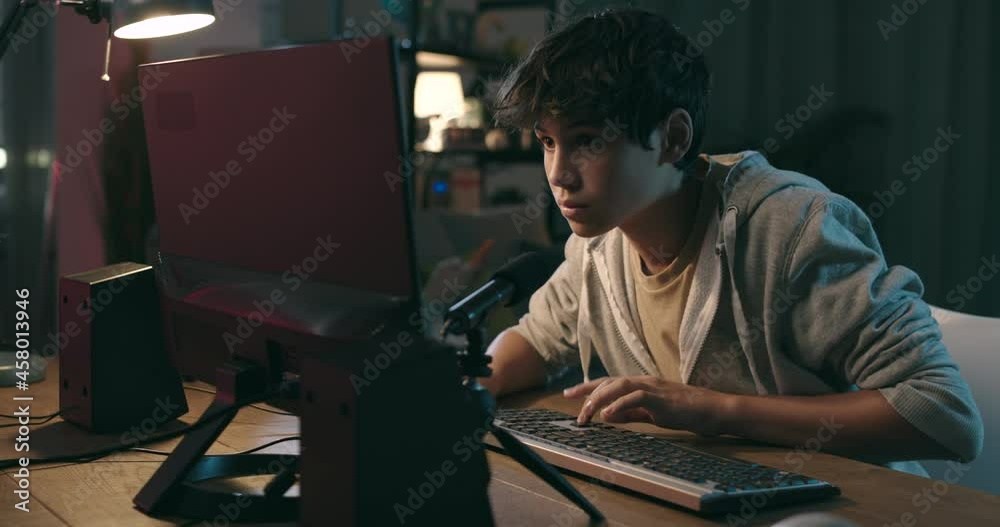 Happy teenager winning at video games