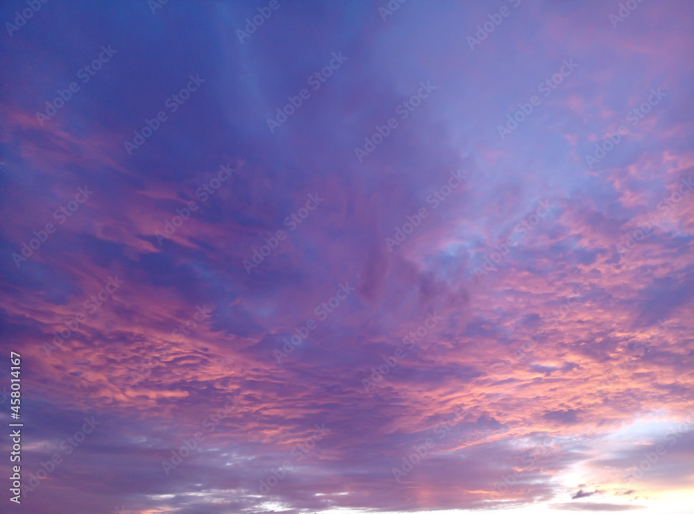 sky with blue, white and pink storm clouds at the bottom. sunset sky. nature background, fabulous, magical sky