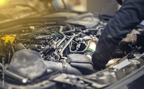 car repair in a car service, hood raised