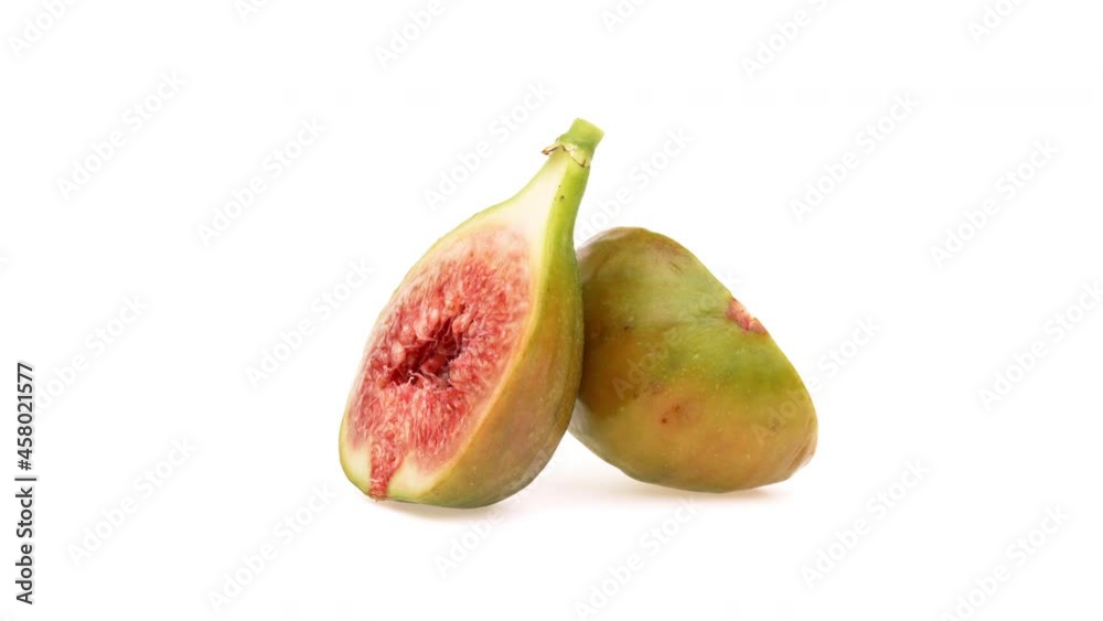 Two fig halves. Rotating on white background. Two fig halves. Rotating on white background.