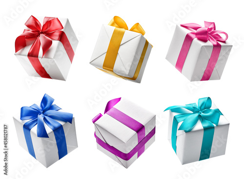 Birthday present - Set of white color gift boxes with colorful ribbon isolated on white background photo