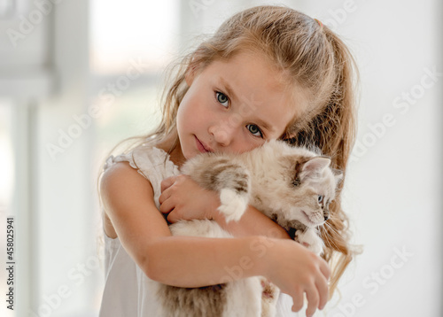 Girl with ragdoll kitten