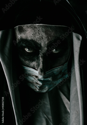 scary evil nun wears a dirty face mask