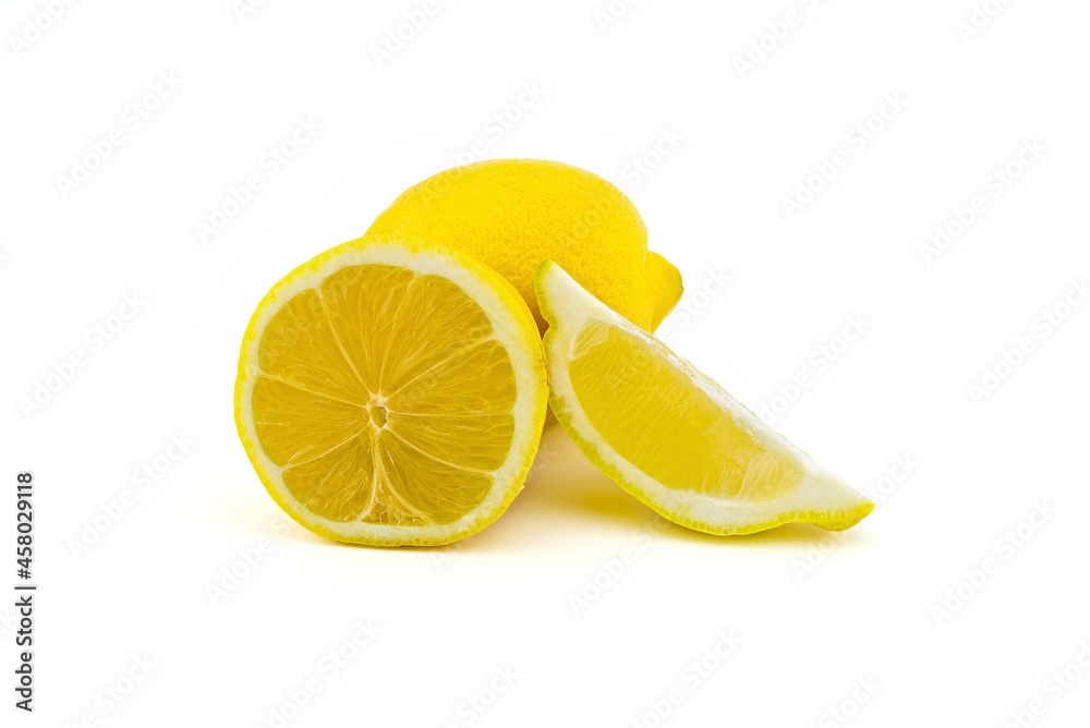 Whole and halved ripe lemon fruit on white Whole and halved ripe lemon fruit on white