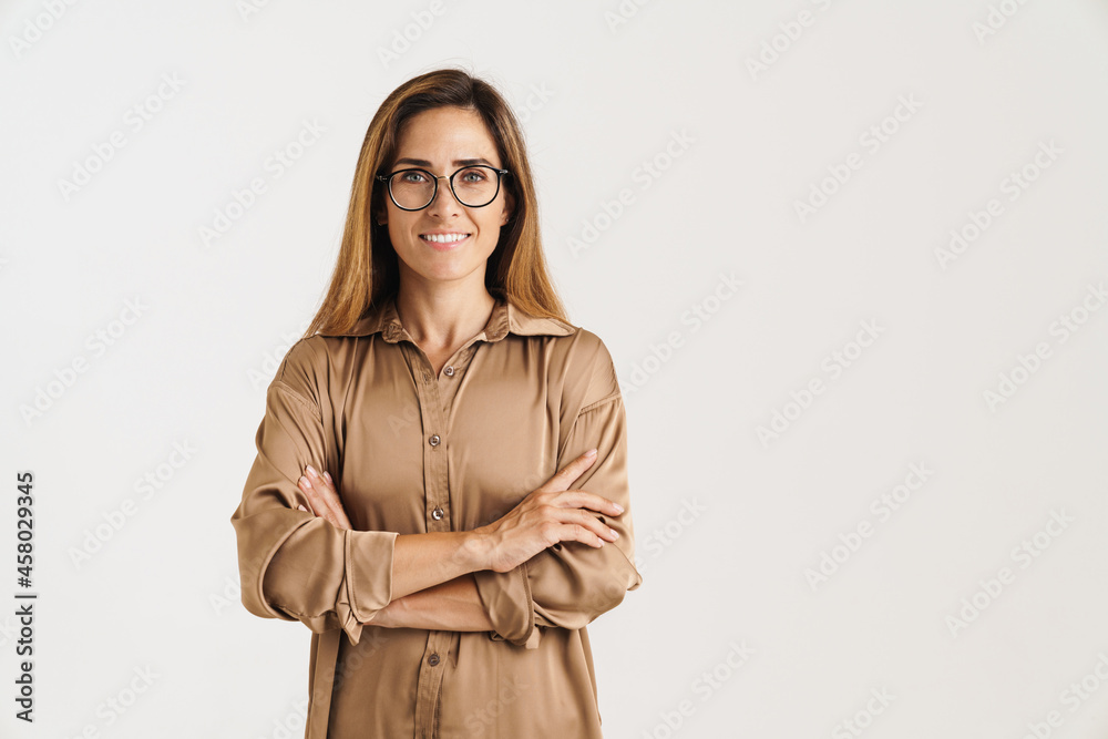European ginger woman in eyeglasses looking and smiling at camera European ginger woman in eyeglasses looking and smiling at camera