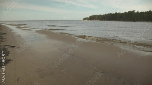 River entering the sea with sandbank in the foreground