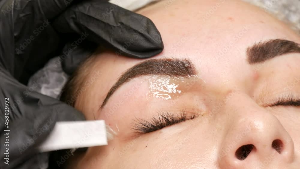 Removal of unnecessary, excess hairs on face. Eyebrow correction using warm wax at the beautician