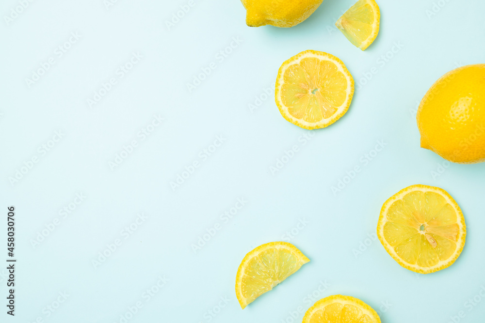 Fresh lemon pattern frame on a bright blue background flat lay Fresh lemon pattern frame on a bright blue background flat lay