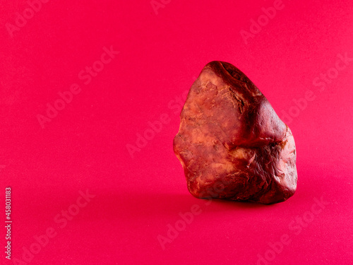 red stone in red background