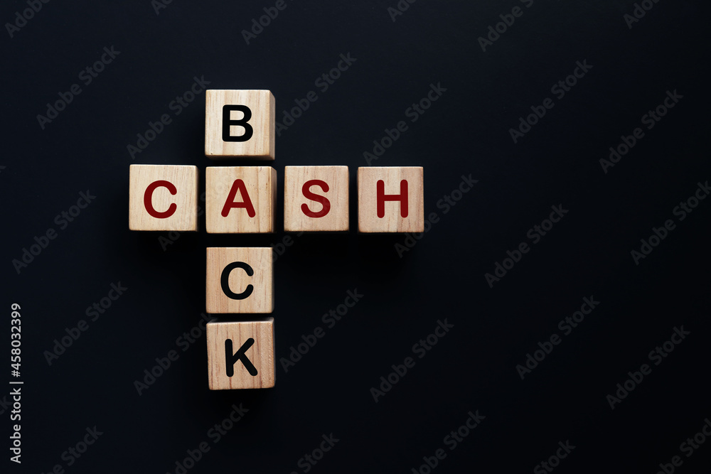 Stacked wooden cubes with the word CASHBACK on pastel background. financial concept Stacked wooden cubes with the word CASHBACK on pastel background. financial concept