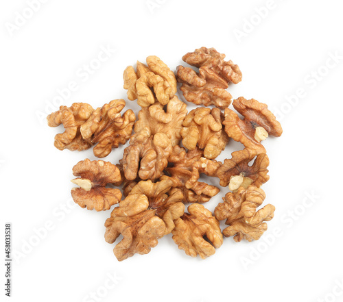 Pile of peeled walnuts on white background, top view