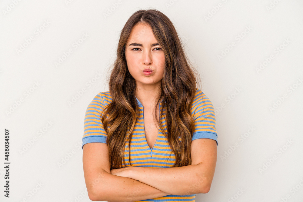 Young caucasian woman isolated on white background blows cheeks, has tired expression. Facial expression concept. Young caucasian woman isolated on white background blows cheeks, has tired expression. Facial expression concept.