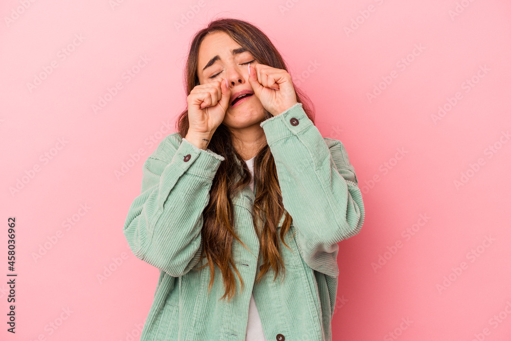 Young caucasian woman isolated on pink background whining and crying disconsolately. Young caucasian woman isolated on pink background whining and crying disconsolately.