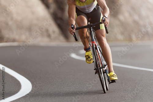 Fototapeta Naklejka Na Ścianę i Meble -  Road bike cyclist man cycling, athlete on a race cycle