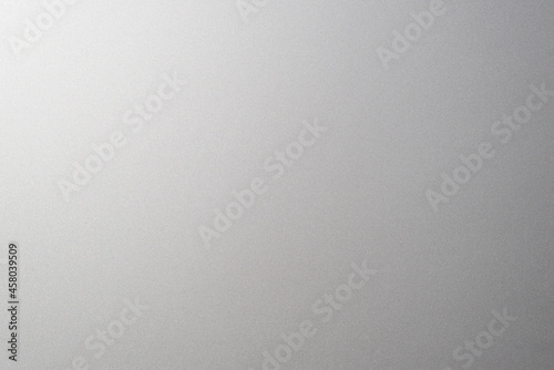 Matte gray smooth plastic surface with fine texture and vignette on the right side. Exquisite textured background, soft blank backdrop