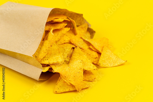 Crispy nachos chips in paper bag for convenience.