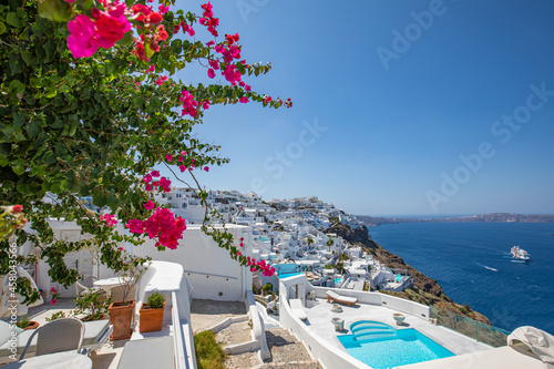 Fototapeta Naklejka Na Ścianę i Meble -  Beautiful panoramic view on the mediterranean blue sea, caldera and volcano. Traditional white architecture of Santorini island, Thira, Greece. Urban idyllic street view, Oia stairs