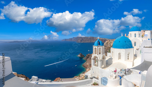 Santorini island, Greece. Incredibly romantic summer landscape on Santorini. Oia village in the morning light. Amazing view with white houses. Island of lovers, vacation and travel background concept