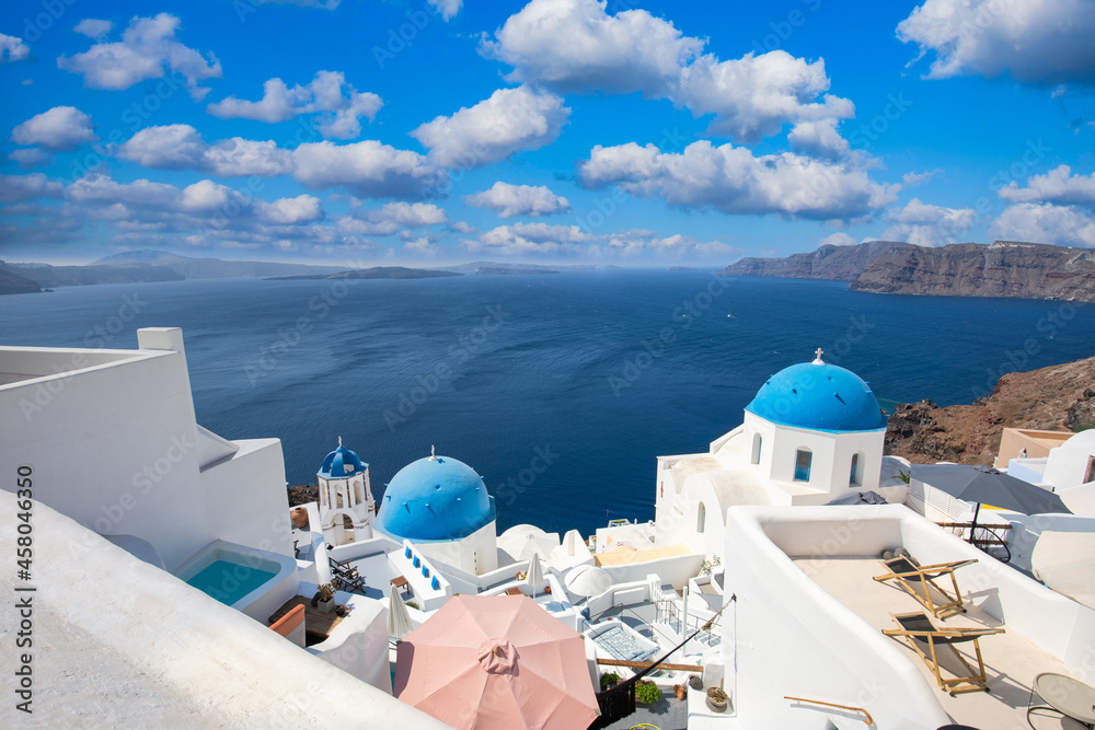 Santorini island, Greece. Incredibly romantic summer landscape on Santorini. Oia village in the morning light. Amazing view with white houses. Island of lovers, vacation and travel background concept
