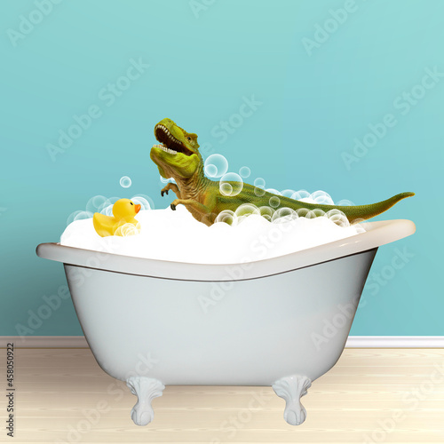 Fotografia Cute green toy dinosar bathing in bath tub with soap foam