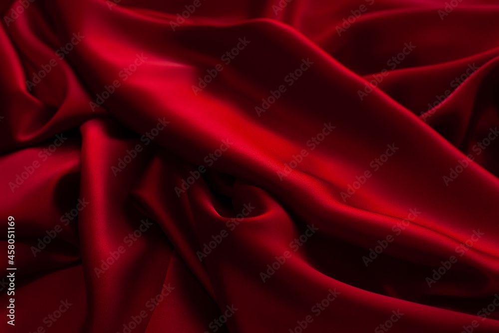 Obraz premium Red fabric texture background. Silk satin folds