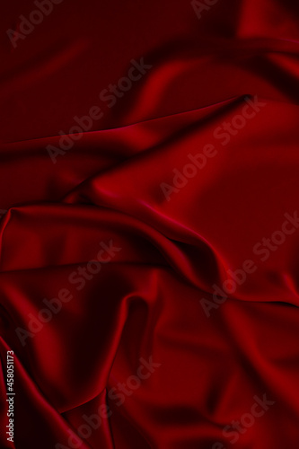 Red smooth cloth folds texture background