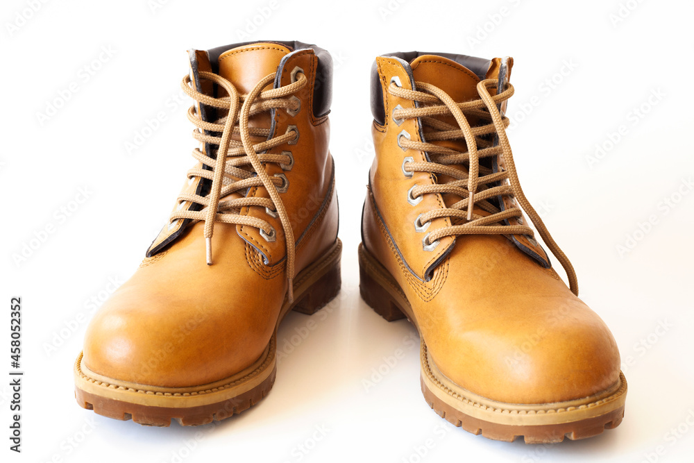 Light brown leather shoes on a white background