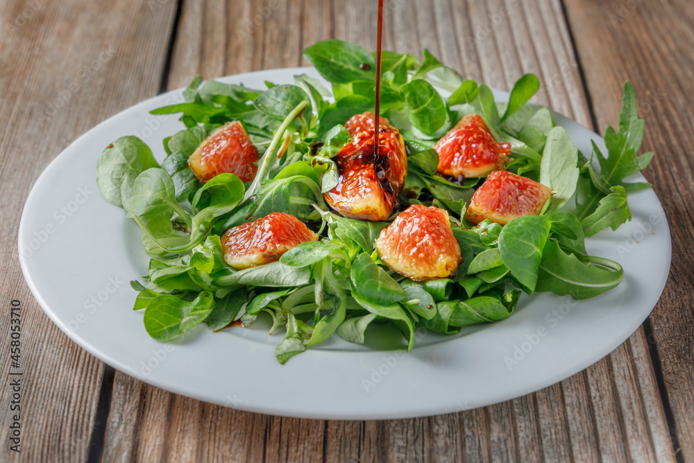 Healthy fig salad with lamb's lettuce and arugula and other vegetables. Healthy fig salad with lamb's lettuce and arugula and other vegetables.