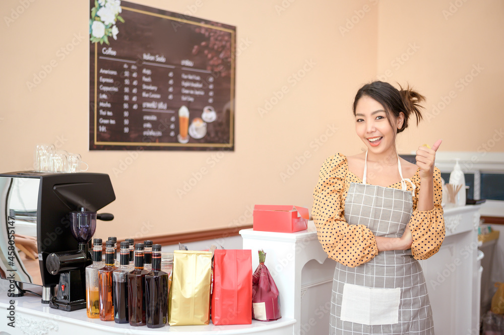 A beautiful woman bakery or coffee shop owner is smiling in her shop A beautiful woman bakery or coffee shop owner is smiling in her shop