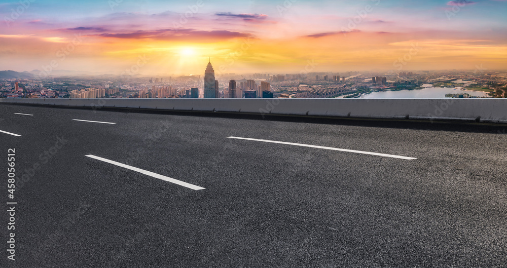 Fototapeta premium Panoramic skyline and empty asphalt road with modern buildings