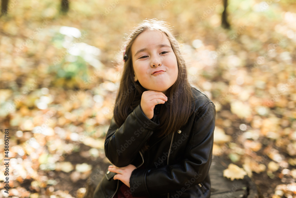 Asian child girl laughing and playing in the autumn on the nature walk outdoors Asian child girl laughing and playing in the autumn on the nature walk outdoors