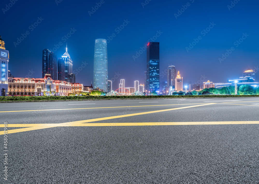 Panoramic skyline and empty asphalt road with modern buildings Panoramic skyline and empty asphalt road with modern buildings