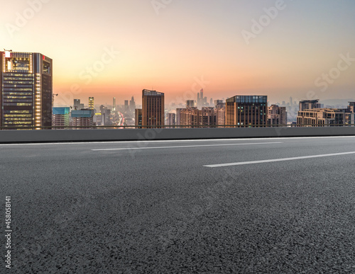 Canvastavla Panoramic skyline and empty asphalt road with modern buildings