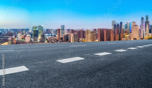 Panoramic skyline and empty asphalt road with modern buildings © 昊 周