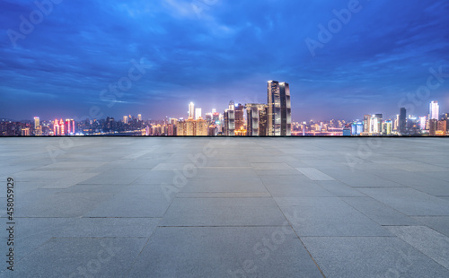 Panoramic skyline and empty square floor tiles with modern buildings © 昊 周